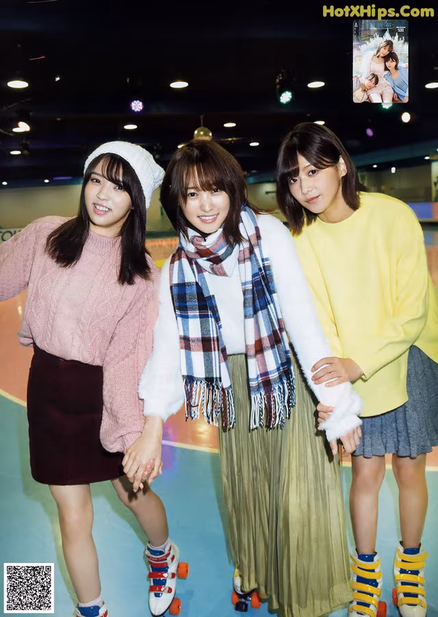 A group of young women standing next to each other on roller skates.